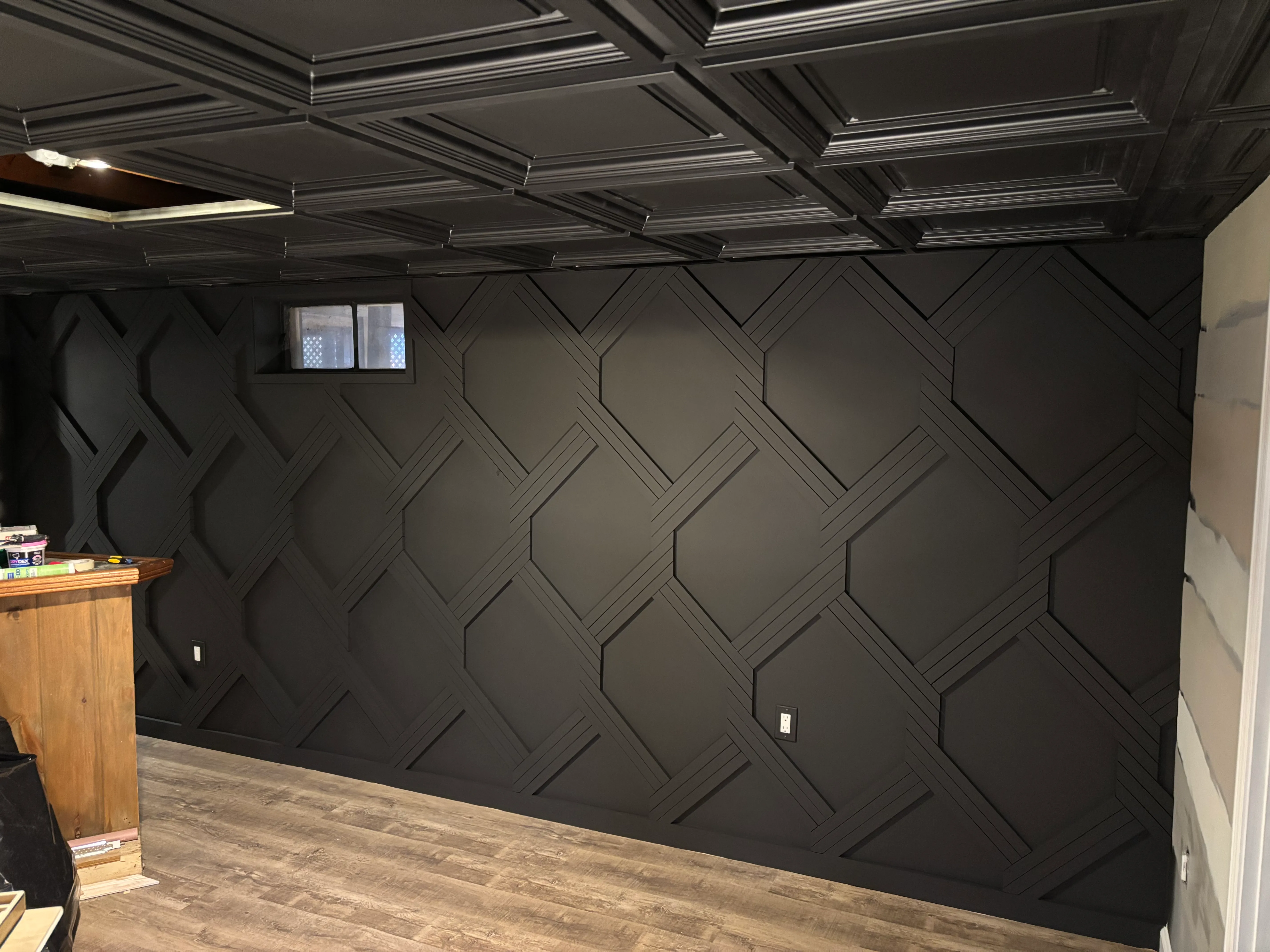 A finished board & batten accent wall painted dark