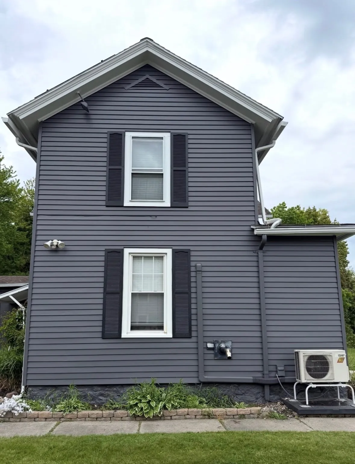 After — Home siding repainted