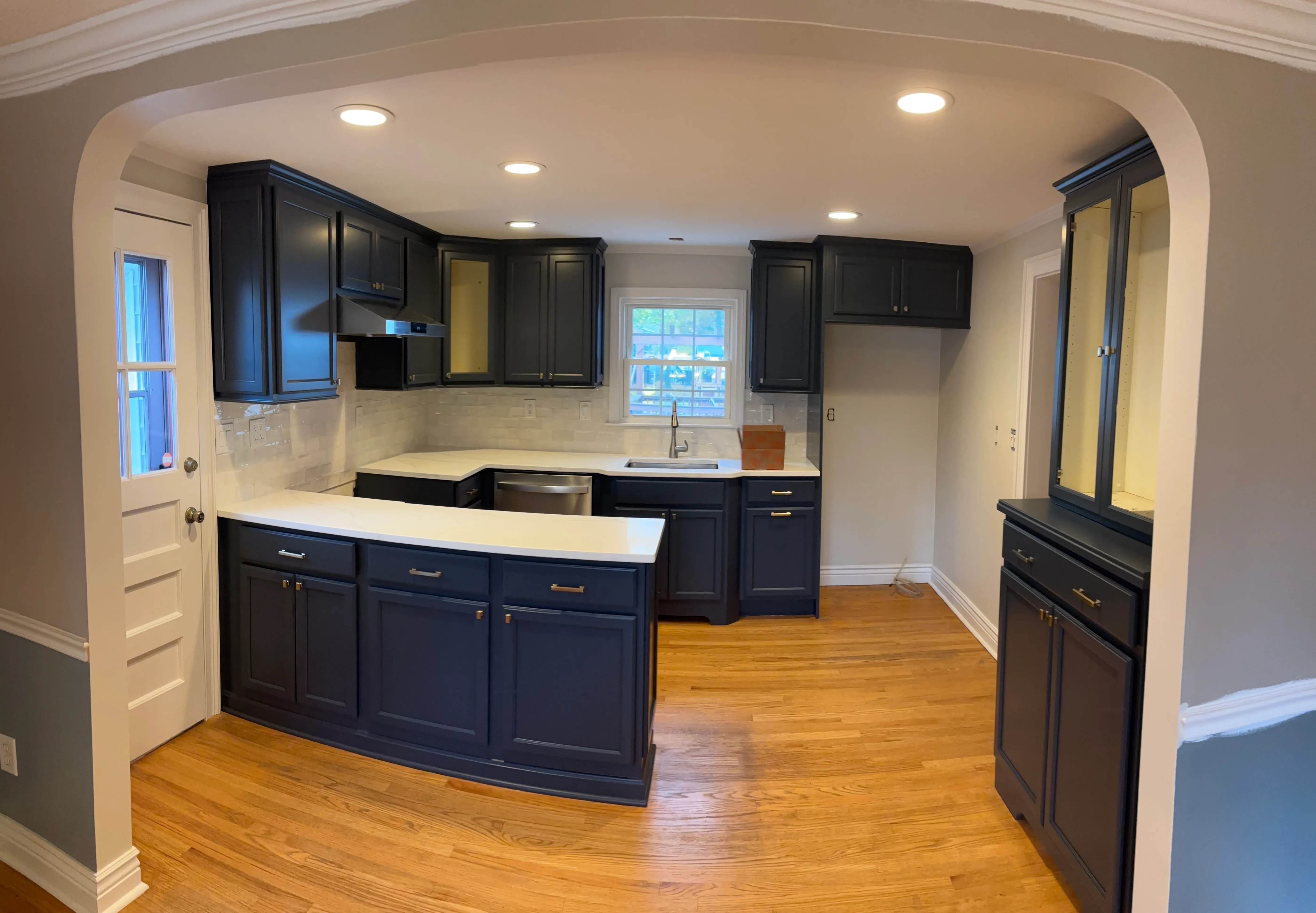 The same kitchen cabinets after refinishing