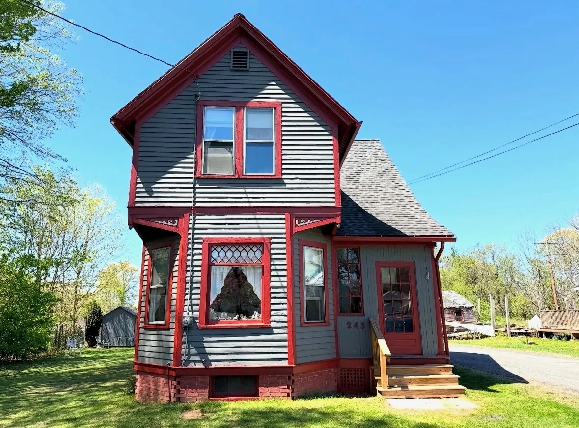 After — Victorian home repainted in period colors (front)