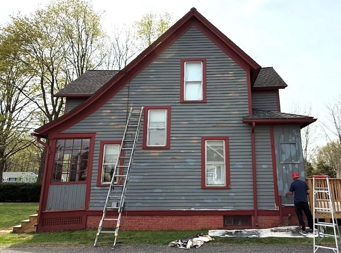 Before — Victorian home repainted in period colors (side)